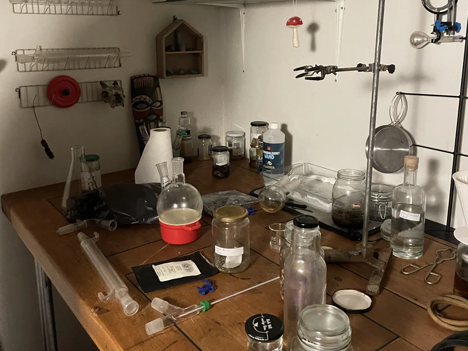 a bunch of jars and equipment in a alchemist laboratory
